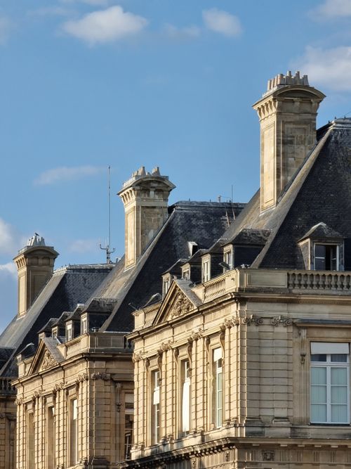 Free Stunning view of classic Parisian architecture with ornate details against a clear blue sky. Stock Photo