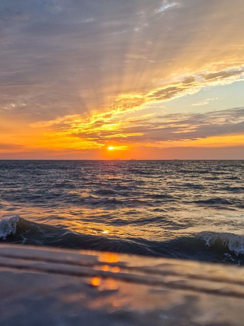 Free Breathtaking sunset over the Persian Gulf in Bushehr, Iran, showcasing stunning colors and reflections. Stock Photo