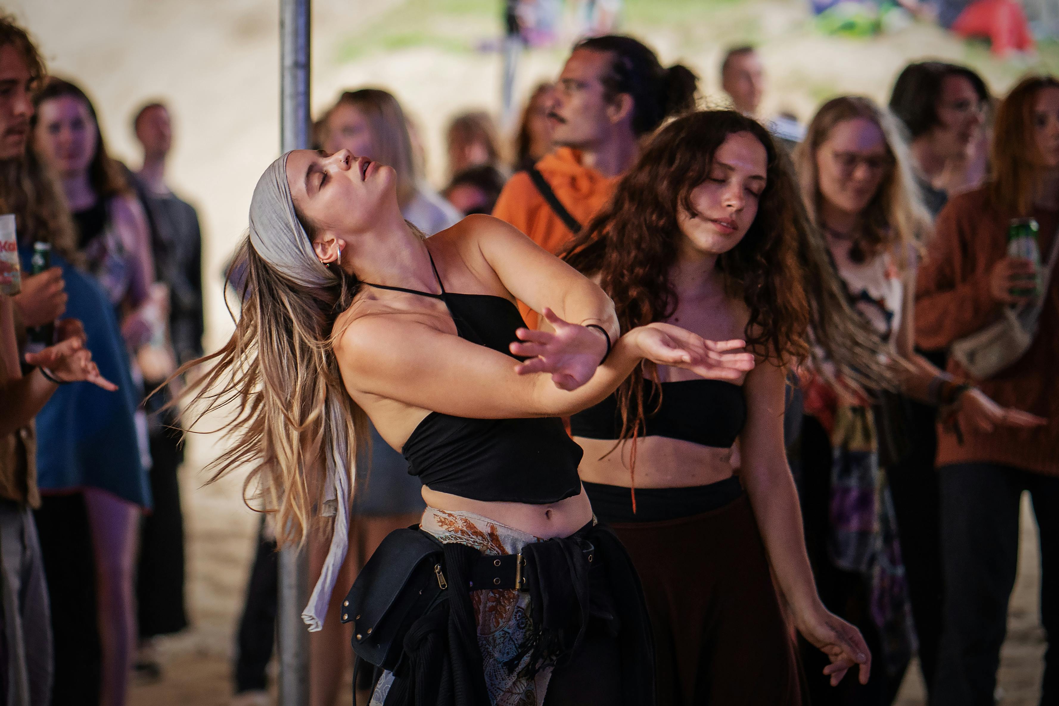 A lively outdoor dance party in Somogybabod, capturing dancers immersed in rhythm and joy.