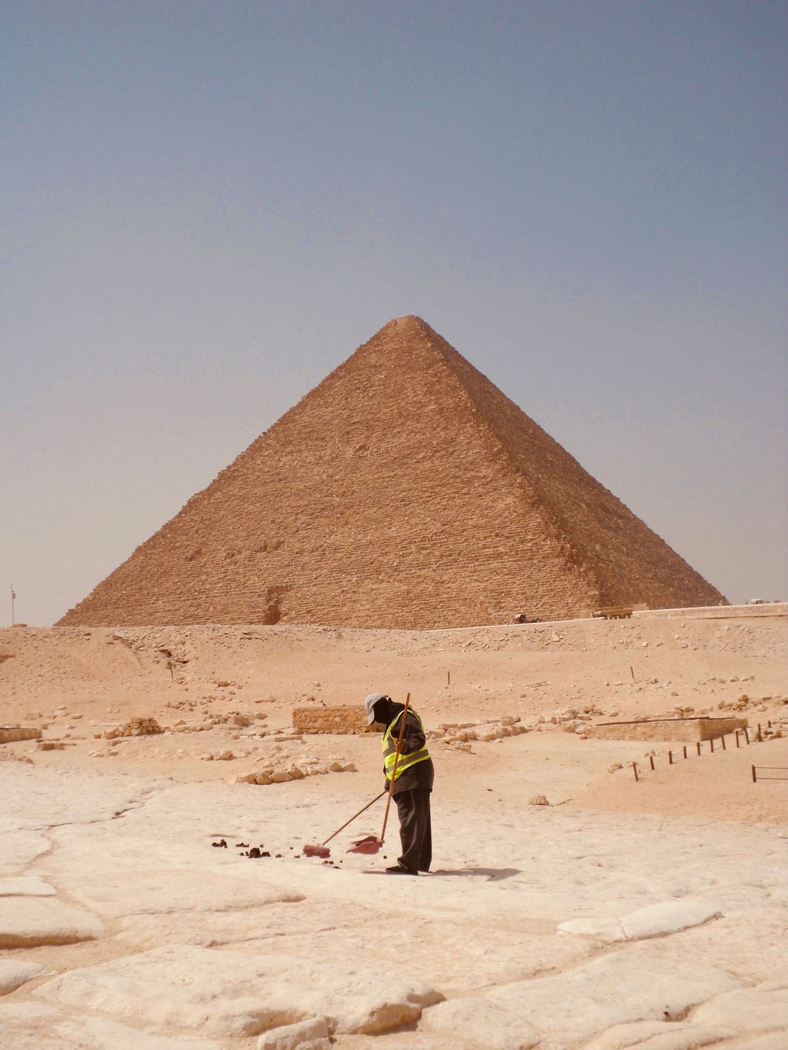 Great Pyramid of Giza with Worker in Foreground · Free Stock Photo