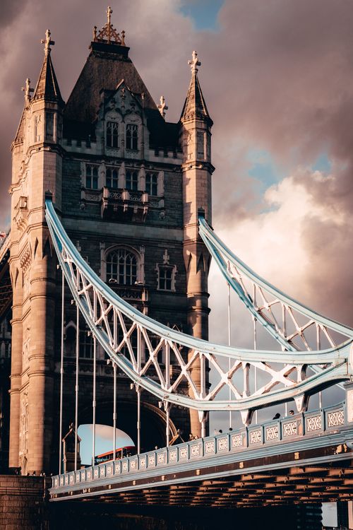 Free A captivating photo of the iconic Tower Bridge in London with dramatic clouds. Stock Photo