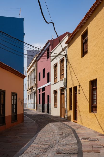 Explore the vibrant streets of San Sebastian with colorful facades and rustic charm.