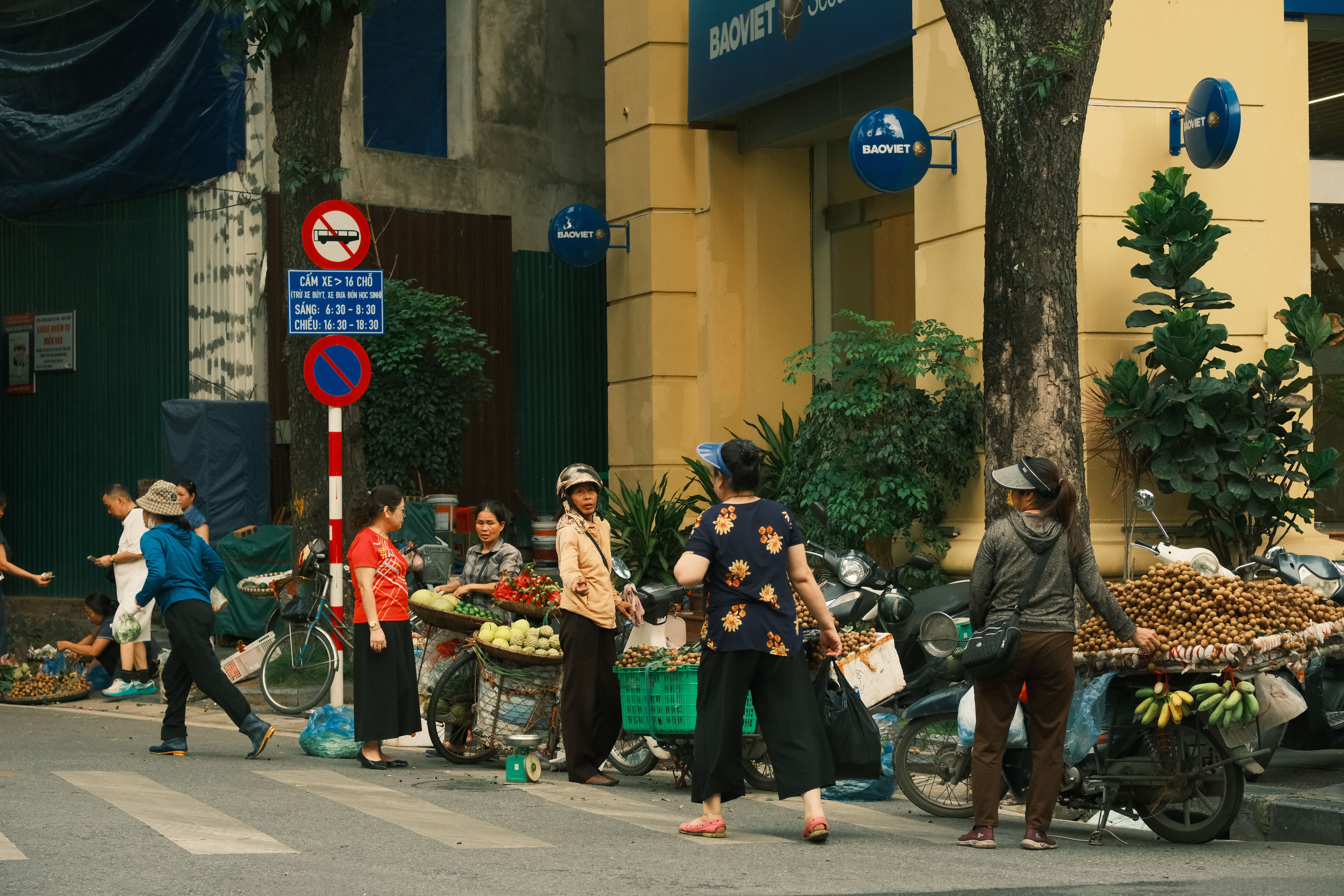 Captivating image of a bustling street market in Vietnam with vendors selling fresh fruits.