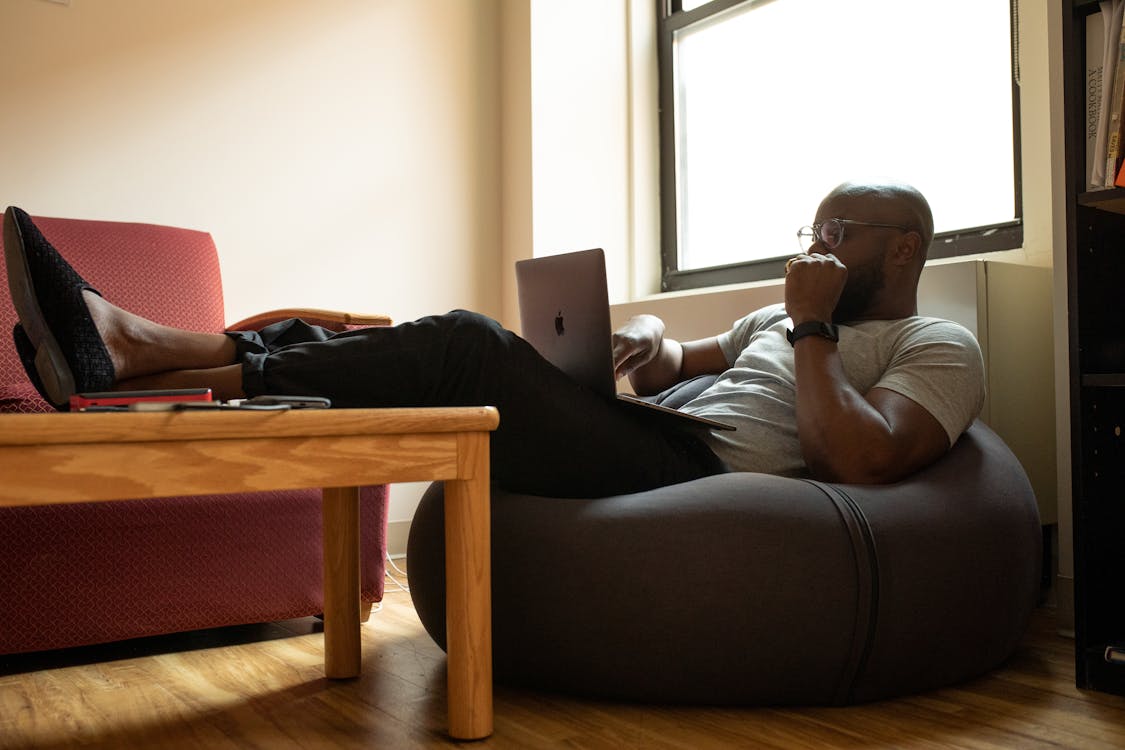 Free Man Using Laptop Stock Photo