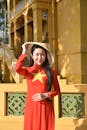 Young Woman in Vietnamese Áo Dài with Conical Hat