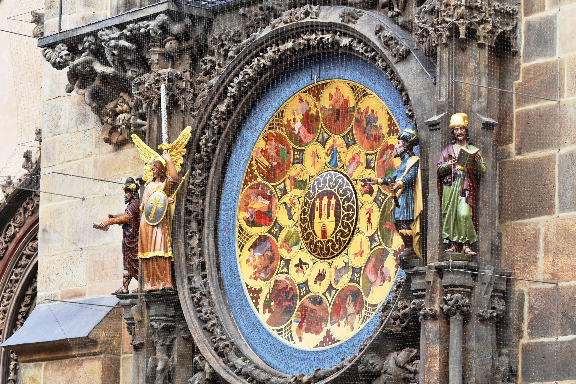 Detailed view of the historic Prague Astronomical Clock with colorful figures and intricate carvings.