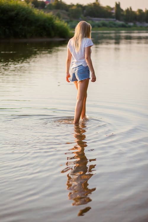 Free Woman Walking on Body of Water Stock Photo