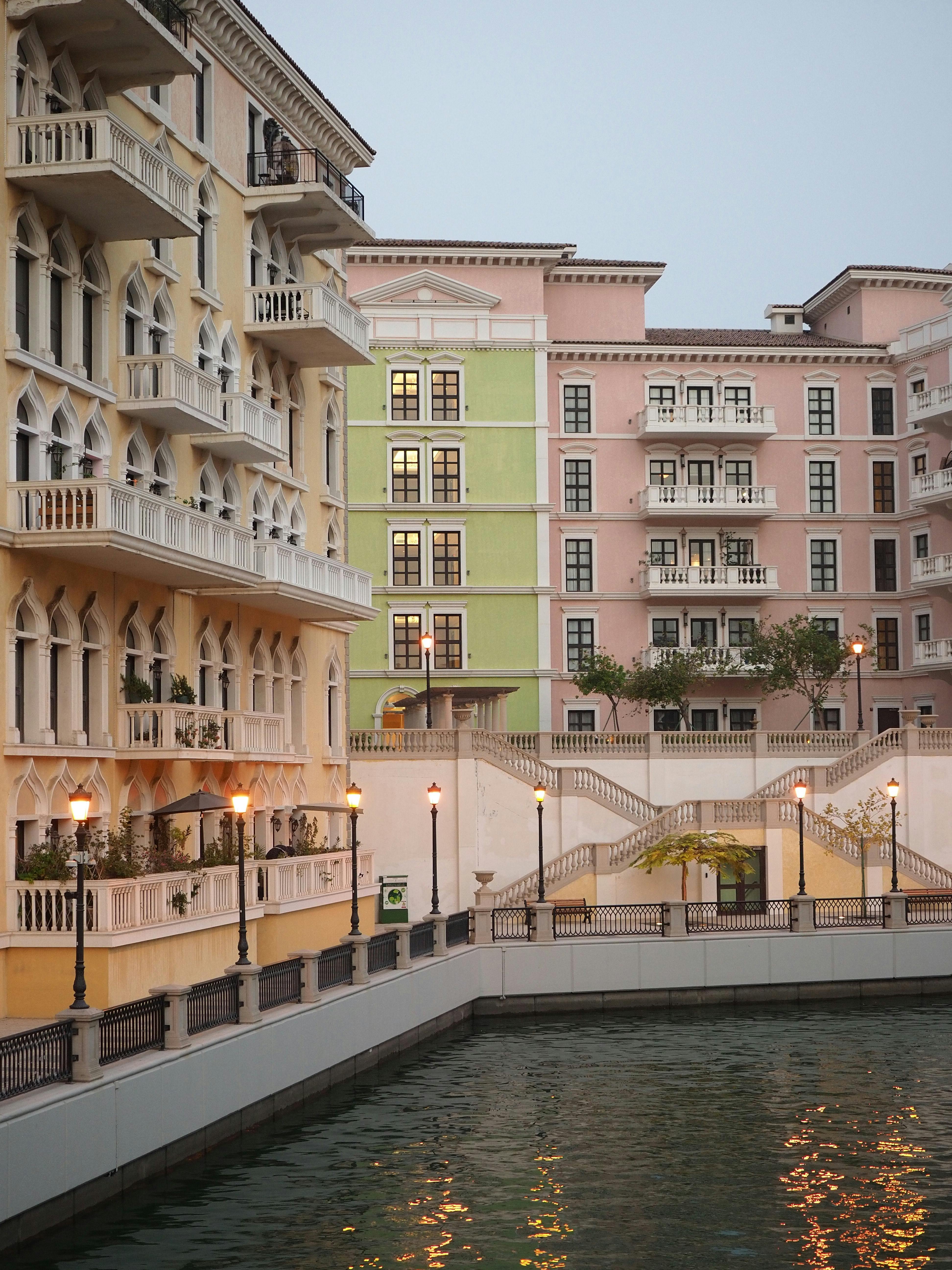 Vibrant apartment buildings in Doha, Qatar at evening dusk. Elegant and tranquil urban scene.