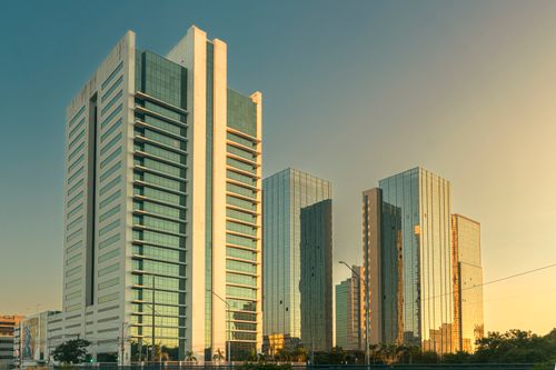 Free A row of modern skyscrapers reflecting sunset light in Porto Alegre, Brazil. Stock Photo
