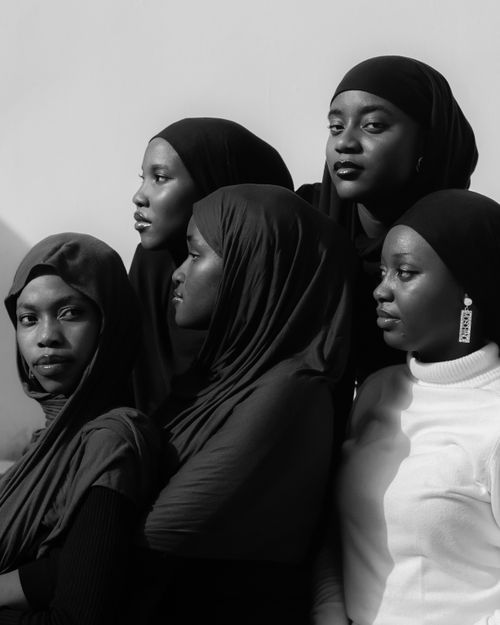 Free Artistic black and white portrait of five women wearing hijabs, capturing strength and unity. Stock Photo