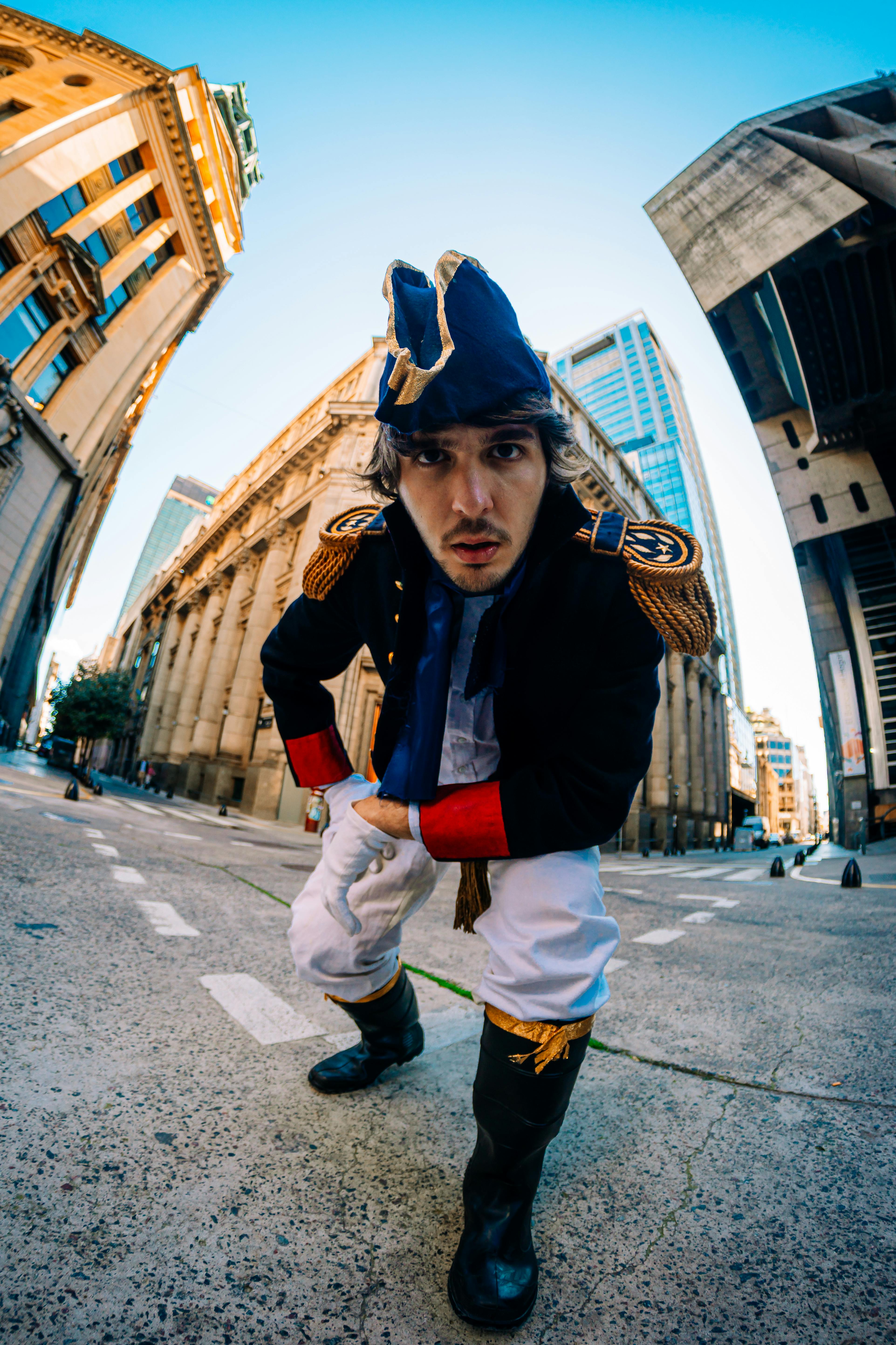 Man in historical costume poses on a street in Buenos Aires, Argentina.