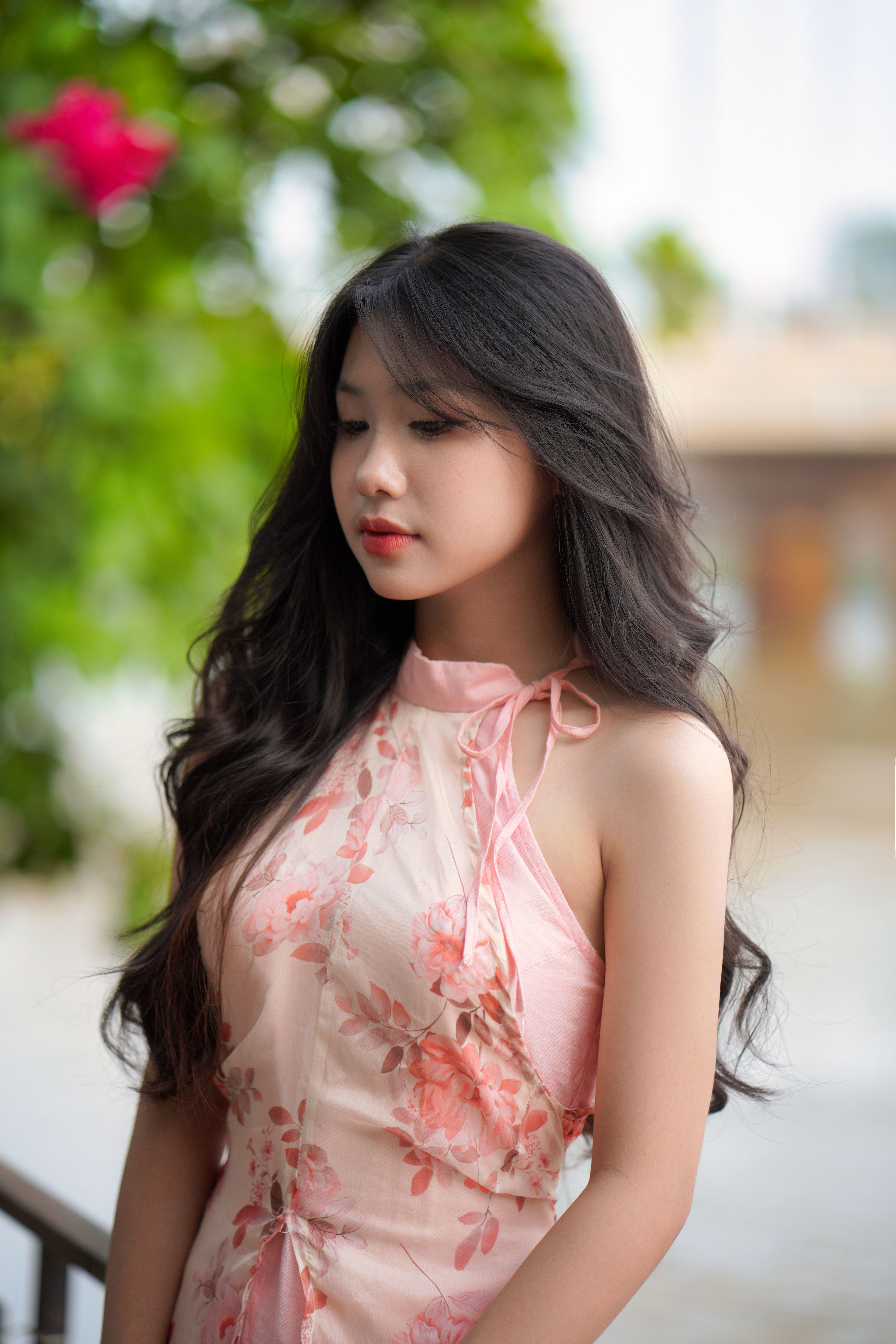 Young Woman in Floral Dress Outdoors · Free Stock Photo