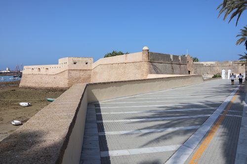 Free Historic fortress in Cádiz, Andalusia, with coastal view and clear blue sky, ideal for travel and architecture themes. Stock Photo