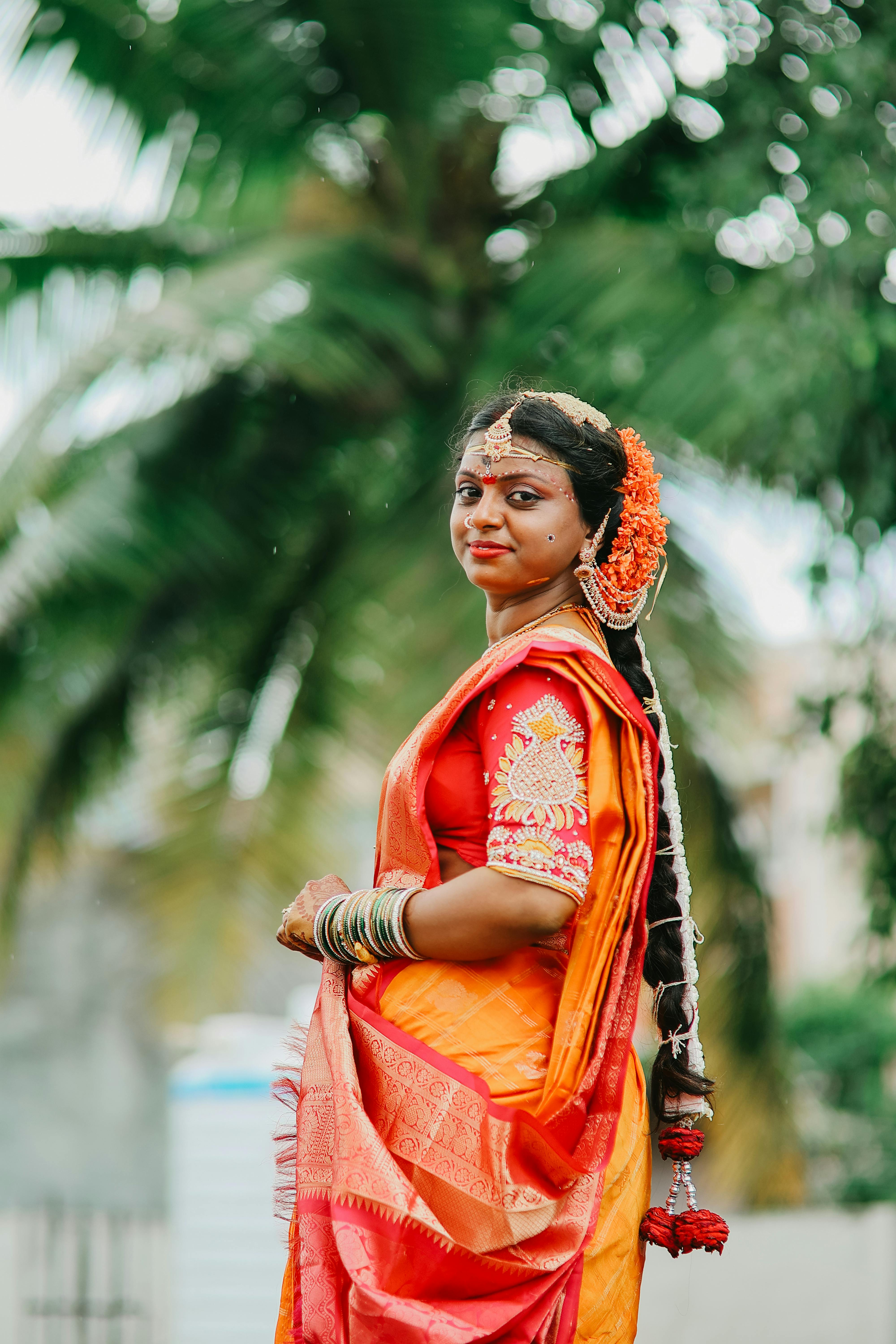 Beautiful South Indian bride in traditional attire with floral accessories, Telangana, India.