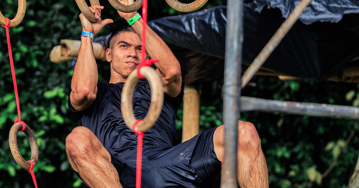 Navigate Obstacles Man Navigating Obstacle Course Rings Outdoors · Free Stock Photo