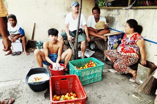 Free Vibrant street market scene featuring local vendors with colorful produce in a bustling setting. Stock Photo