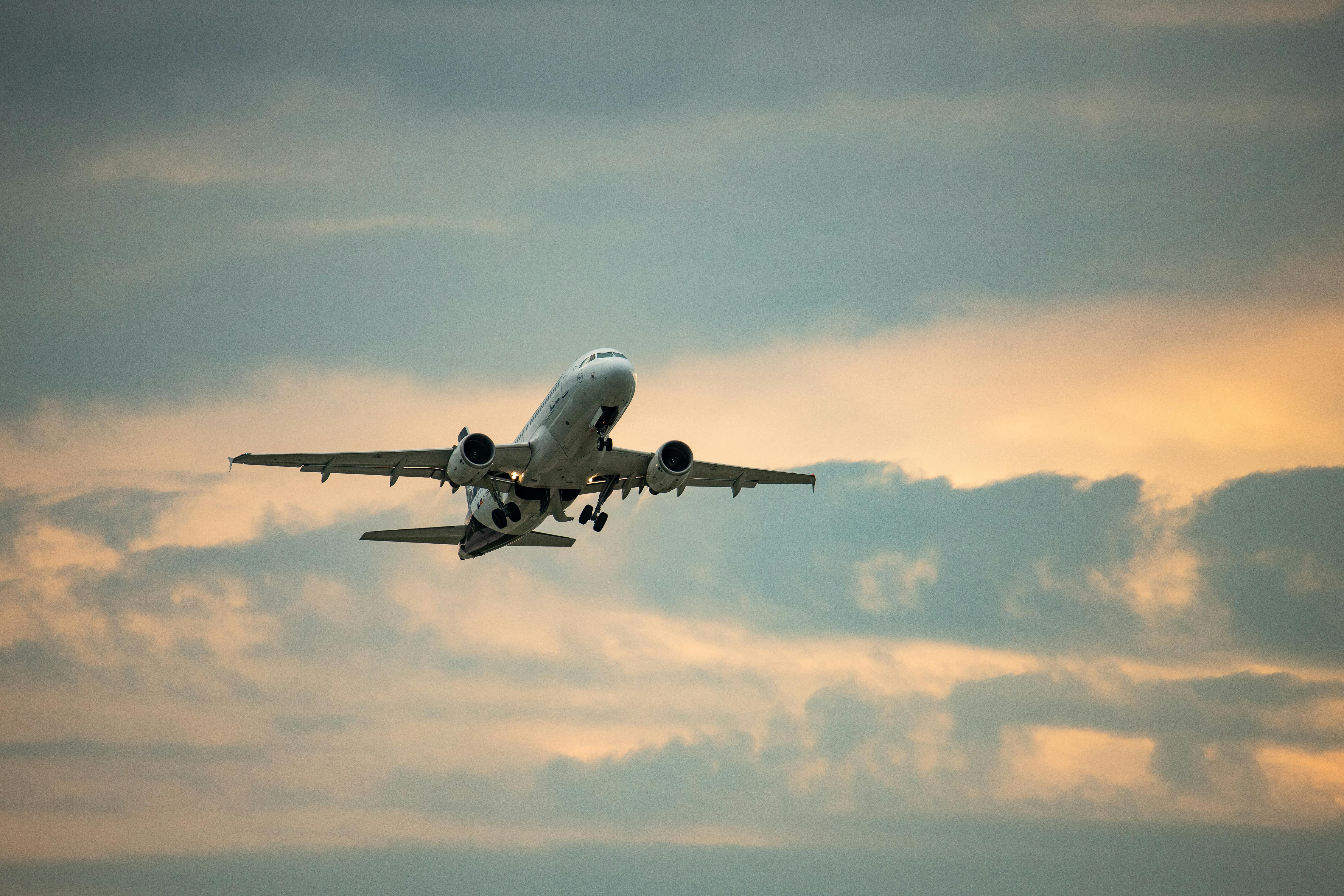 Free Airplane takes off against a dramatic sky at Munich Airport, Germany. Stock Photo