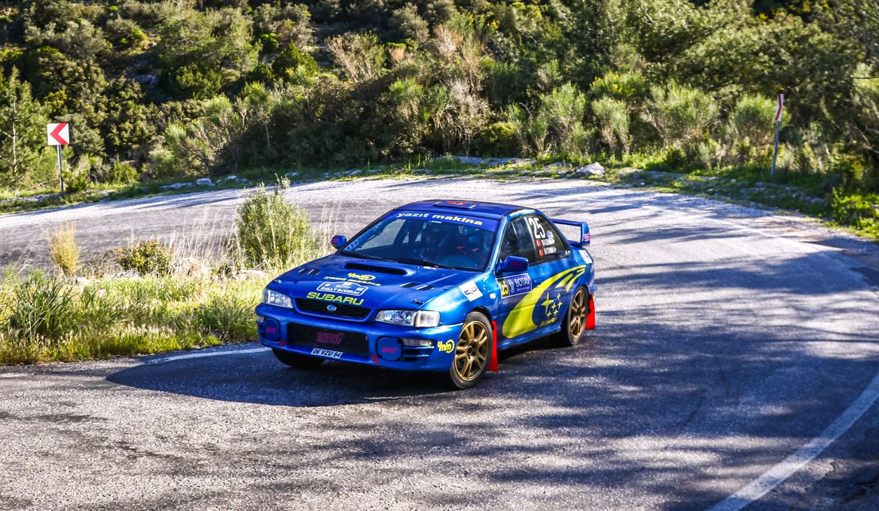 Subaru Rally Car on Scenic Mountain Road · Free Stock Photo
