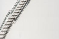 Minimalist Industrial Metal Staircase Against White Wall