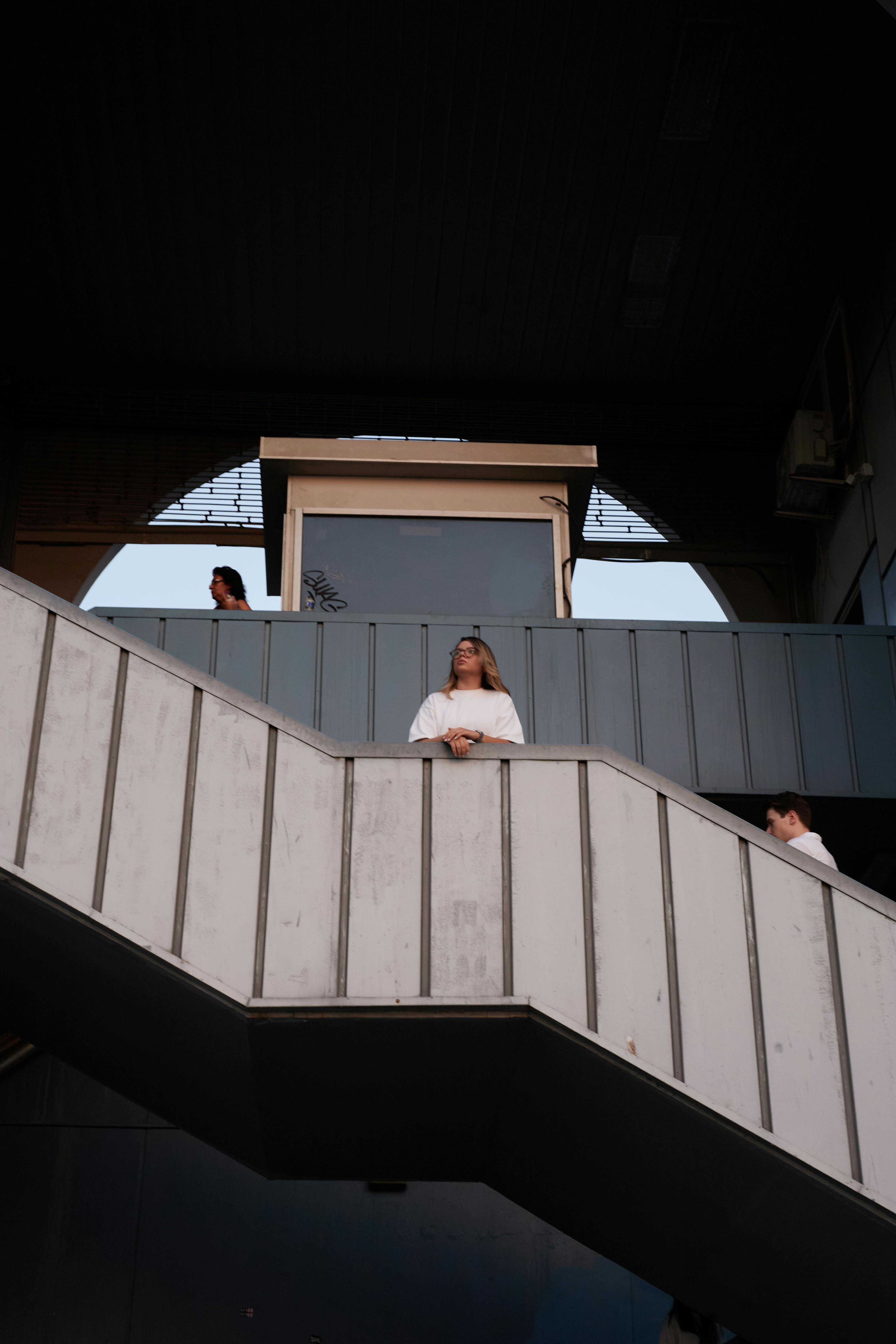 People on a geometric staircase in İstanbul, creating an urban scene.