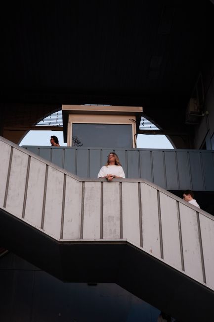 People on a geometric staircase in İstanbul, creating an urban scene.