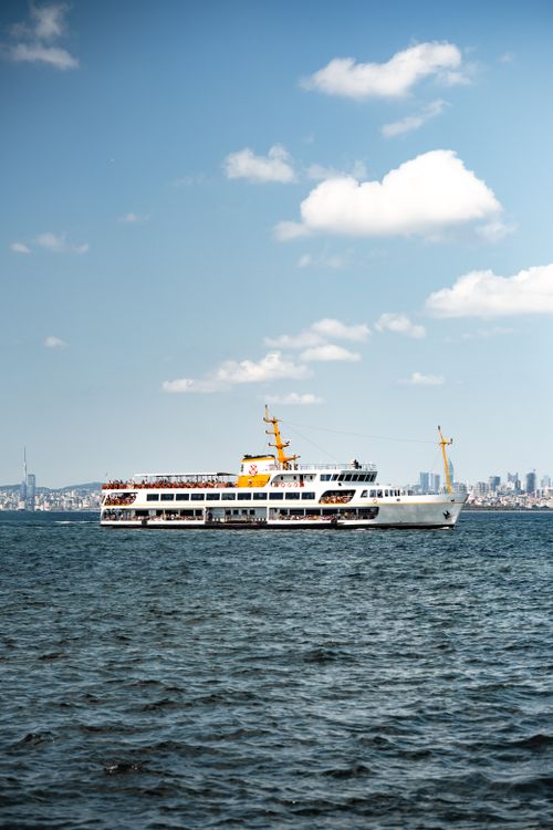 Free Ferry boat sailing on the Bosphorus with Istanbul skyline in the background. Stock Photo