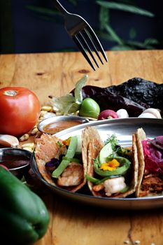 Savor authentic Mexican tacos loaded with fresh shrimp, avocado, and vibrant vegetables, perfect for any occasion.