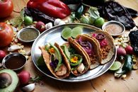 A vibrant array of Mexican tacos served with fresh ingredients, perfect for culinary delight.