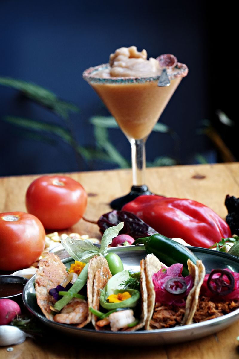 Illustrative tacos and margarita; not a photograph of Solita's meal