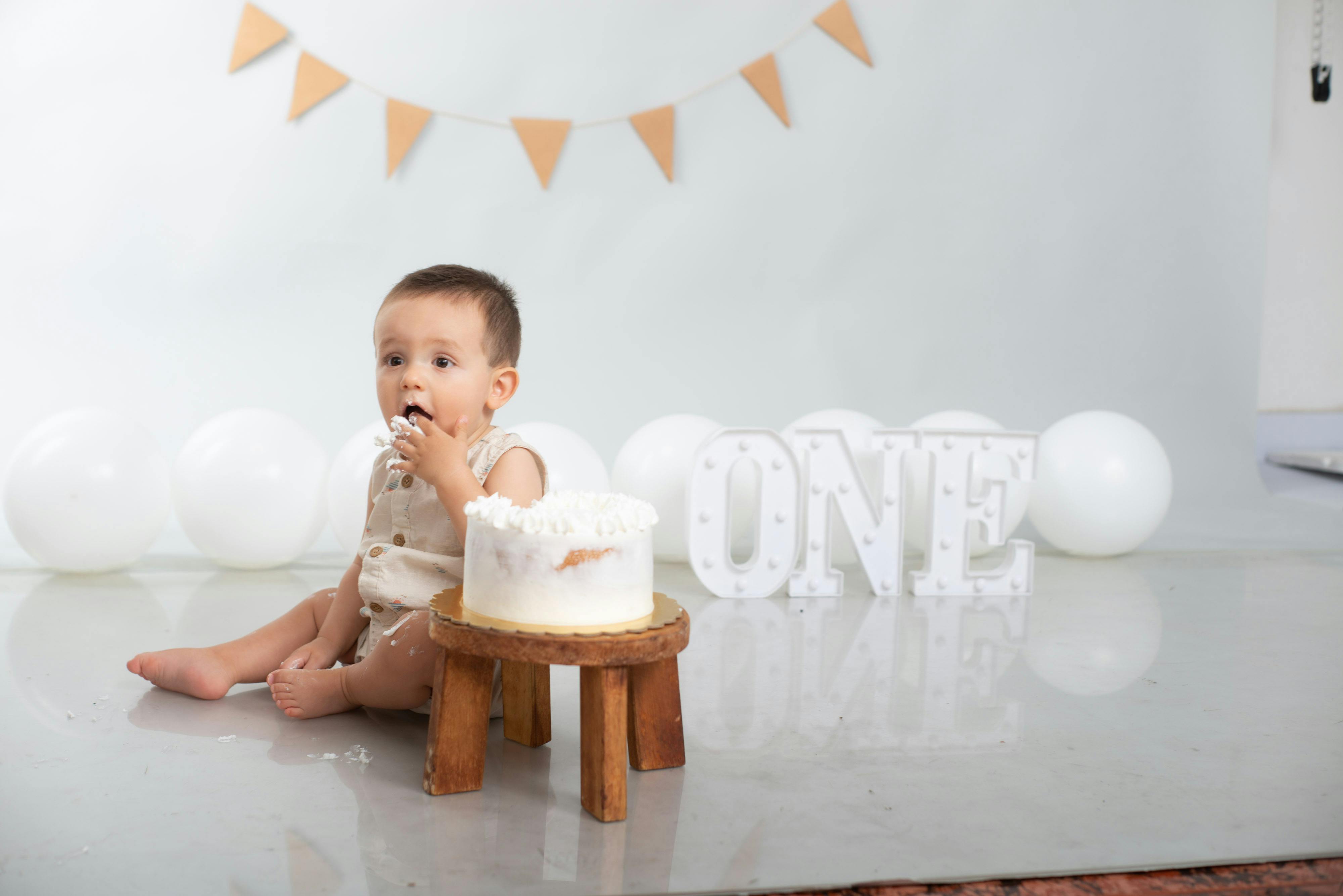 Adorable First Birthday Cake Smash Celebration · Free Stock Photo