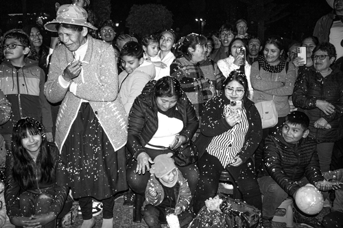Free A joyful nighttime celebration in Arequipa, Peru, capturing smiles and laughter of adults and children. Stock Photo