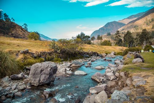 Free Beautiful mountain river landscape in Obrajillo, Peru with clear blue sky and picturesque scenery. Stock Photo