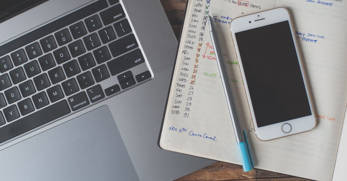 전주 롯데시네마 상영시간표 및 주차요금 안내 A workspace featuring a laptop, smartphone, and planner on a wooden desk, ideal for remote work.