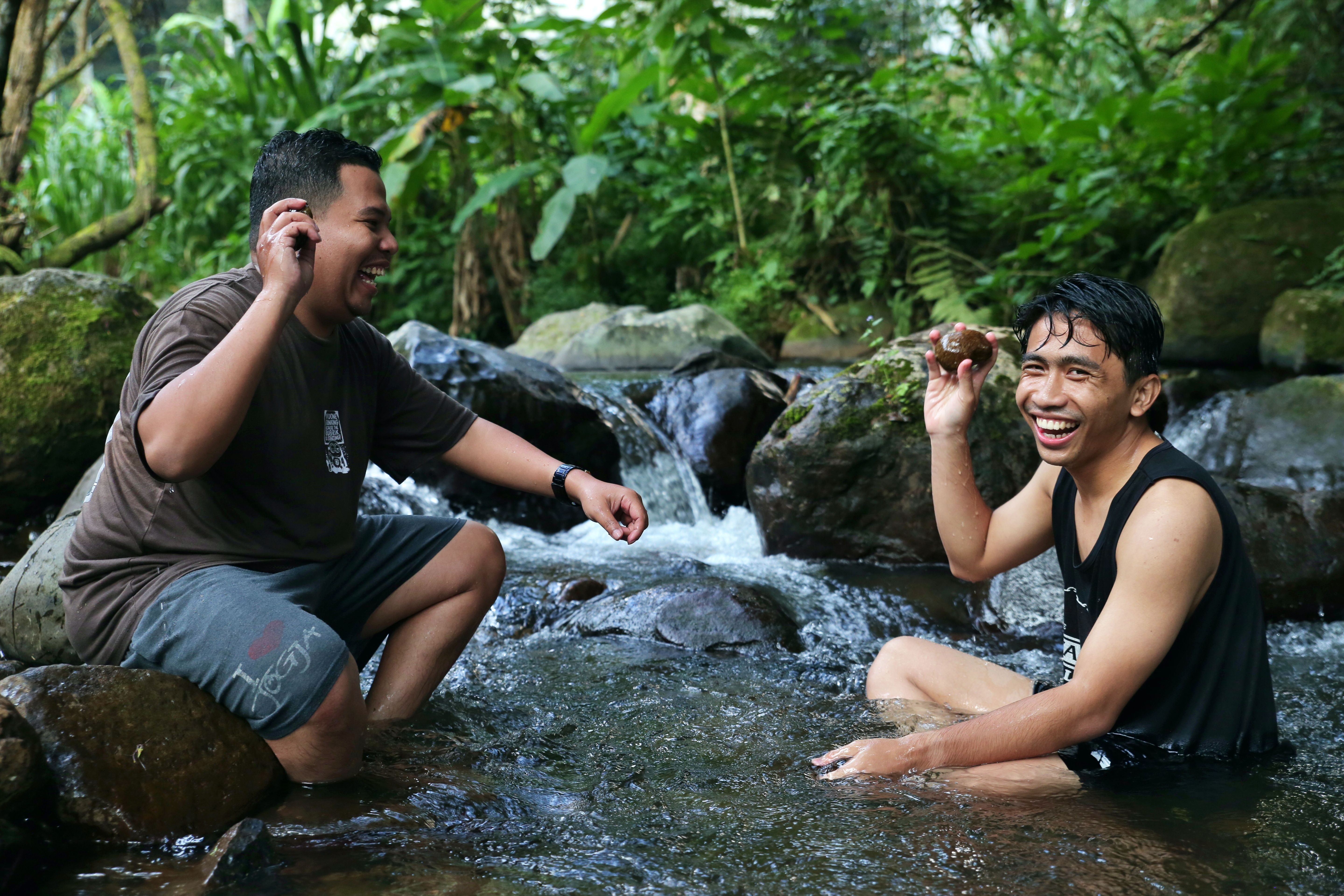 Friends Enjoying a Refreshing Stream Outdoors