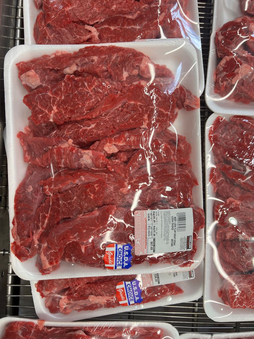 Raw meat packed in supermarket trays, the part of the weekly shop many Australian households notice first when food inflation bites.
