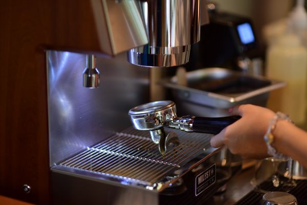 Barista using an espresso machine