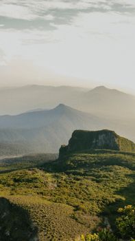 Majestic green mountains in the morning light, creating a serene and inspiring landscape.