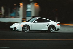 White Porsche 911 in motion