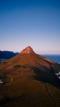 Breathtaking aerial image of Lion's Head in Cape Town at dusk, showcasing natural beauty and coastal landscape.