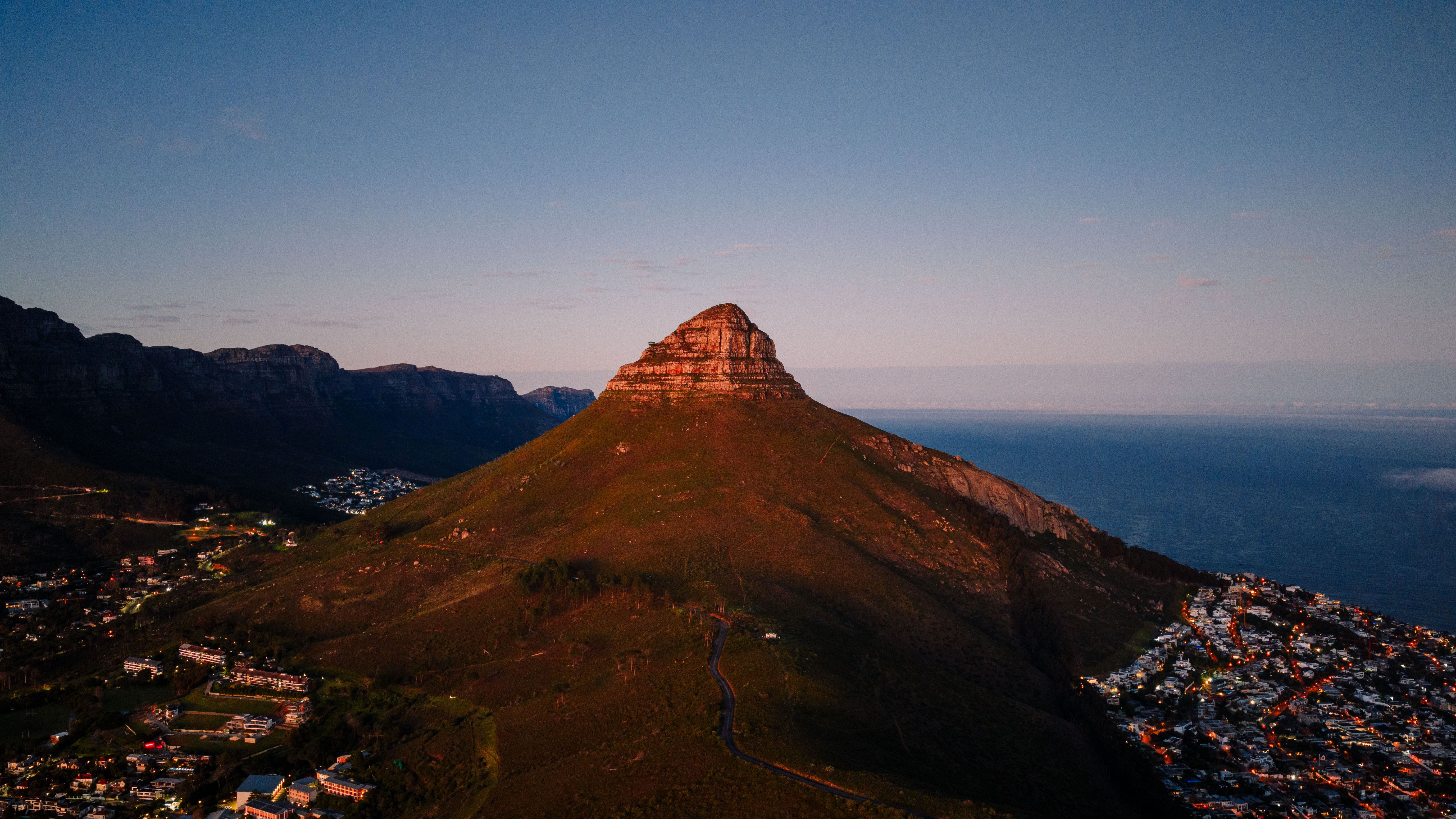 Best Cape Peninsula Helicopter Private Tour with Stellenbosch Wine Tasting & Lunch Review Review 2026 - A breathtaking aerial view of Lion's Head mountain during sunset in Cape Town, showcasing nature's beauty.