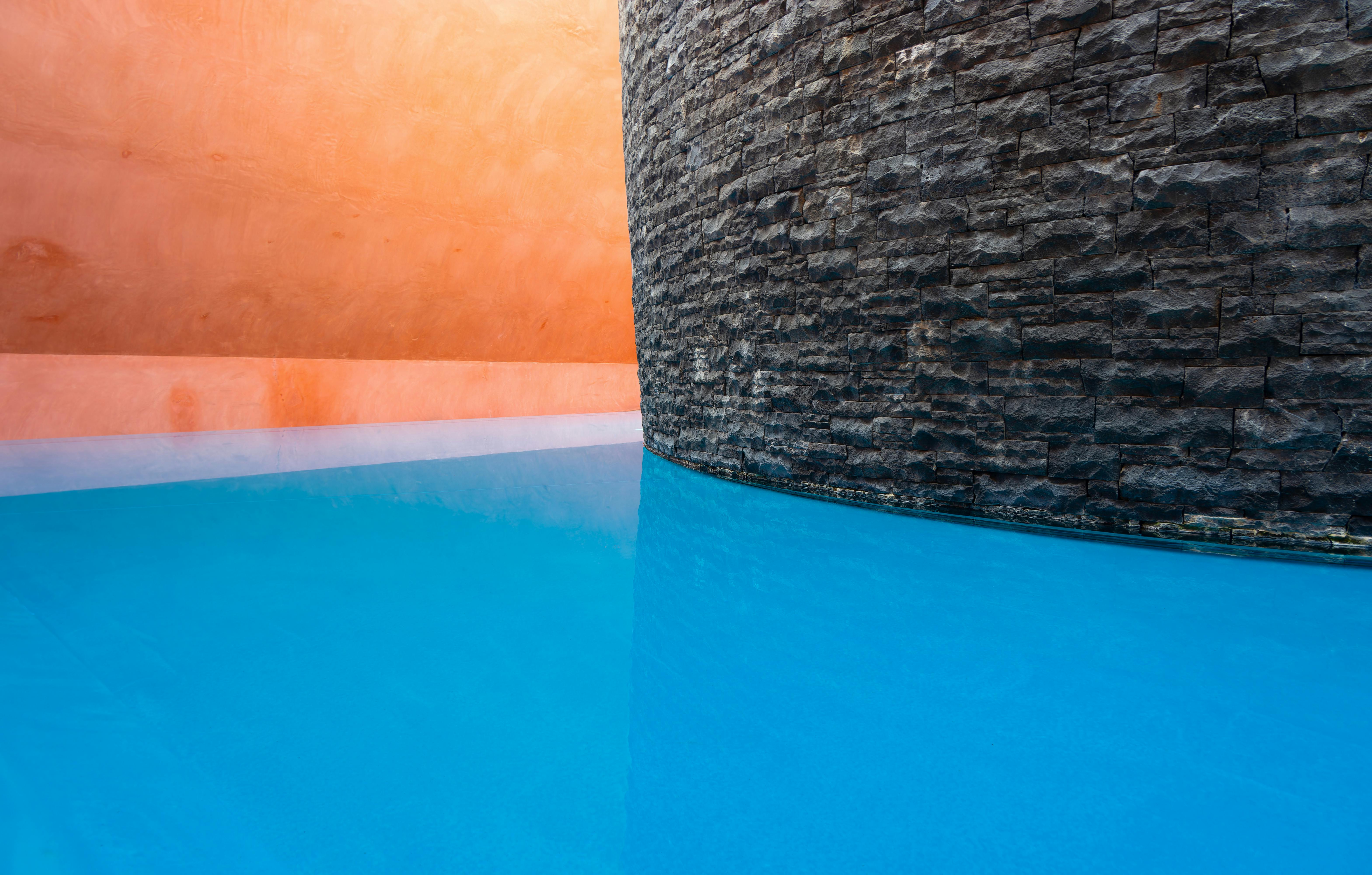 Modern architectural design with vibrant colors and reflective water in Canberra, Australia.