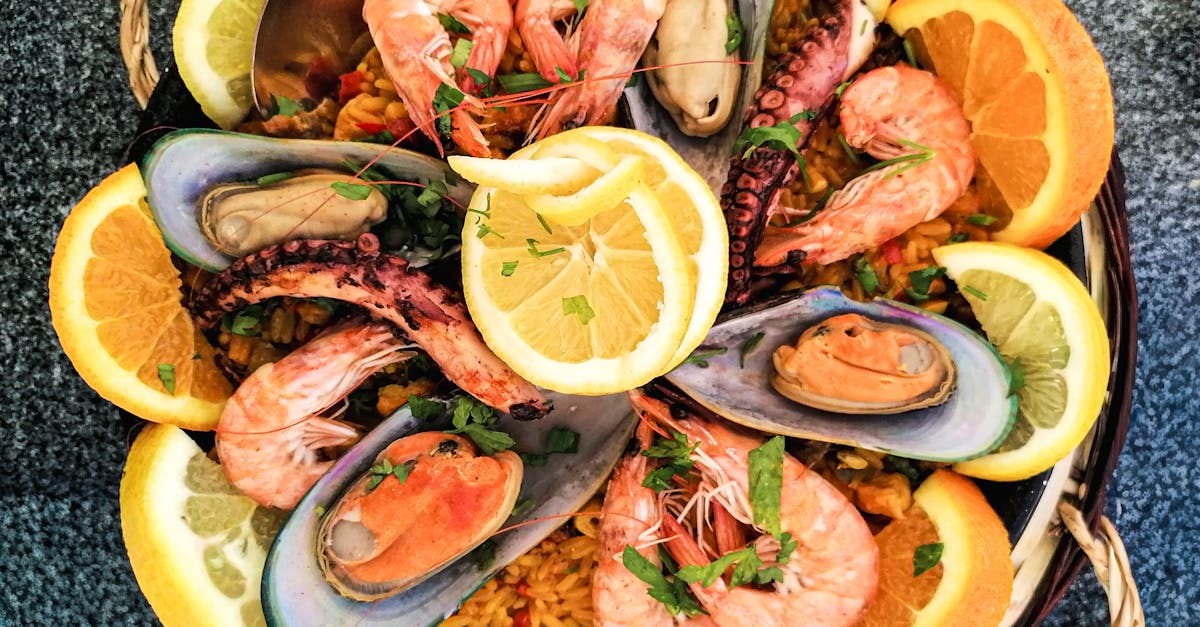 A variety of different types of rice grains displayed on a wooden table.