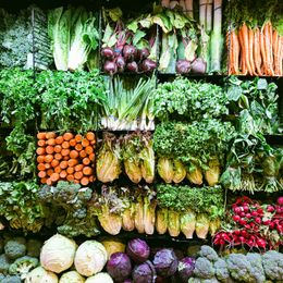 Shelves of fresh seasonal vegetables — photo by Rumata E on Pexels