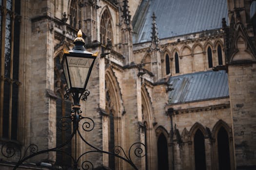 A classic street lantern against the backdrop of York Minster's Gothic architecture.