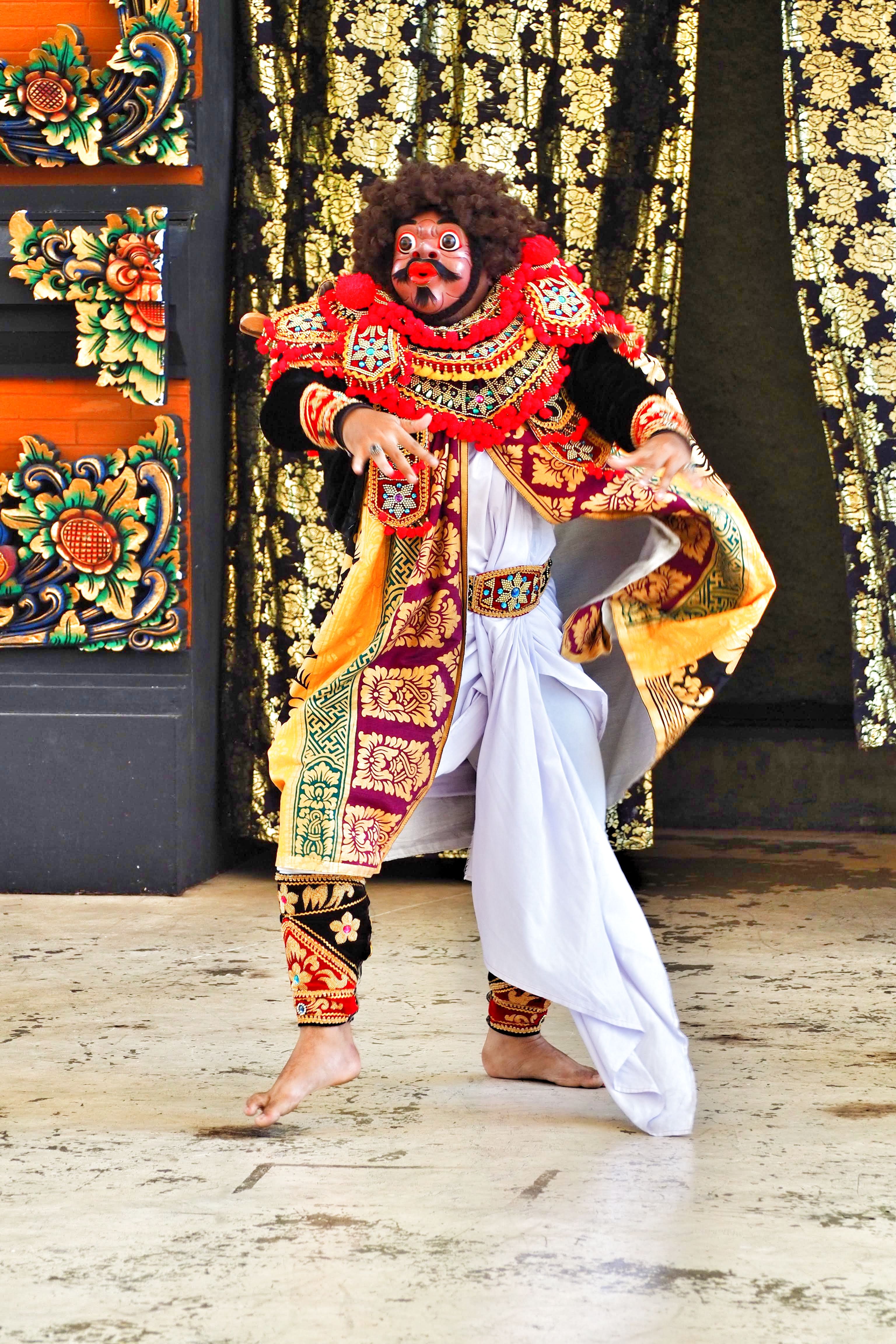 A vibrant display of traditional Balinese dance showcasing rich cultural attire and expressive movements.