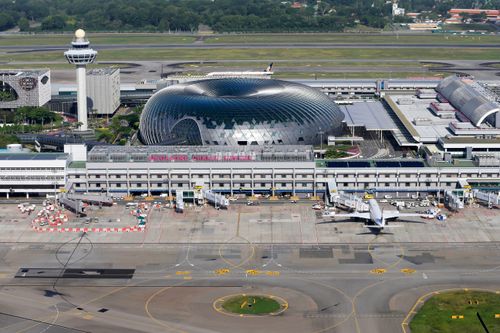 Free Aerial view of Singapore Changi Airport, showcasing modern architecture and bustling airport activity. Stock Photo