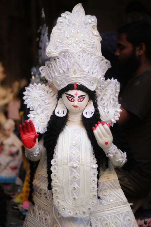 Free Intricately crafted white clay goddess statue in a traditional workshop in Kolkata, India. Stock Photo