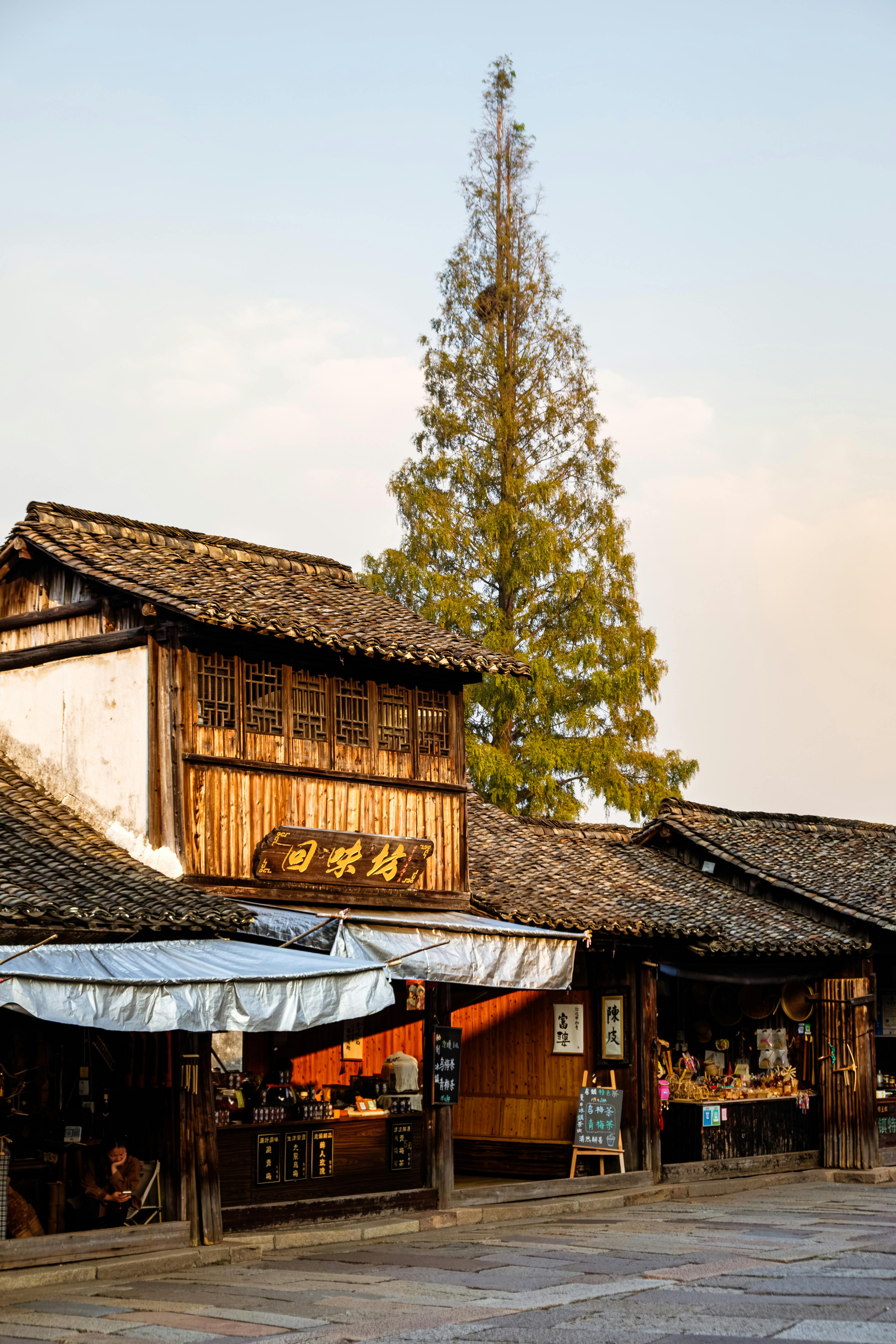 A picturesque view of a traditional wooden market street in China, showcasing local culture.