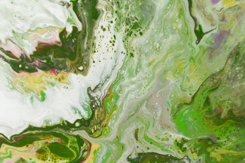 Free Dynamic abstract painting with vivid green and yellow swirls, creating an intricate fluid pattern. Stock Photo