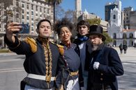 Group of historical reenactors in Plaza de Mayo, Buenos Aires, capturing a selfie.